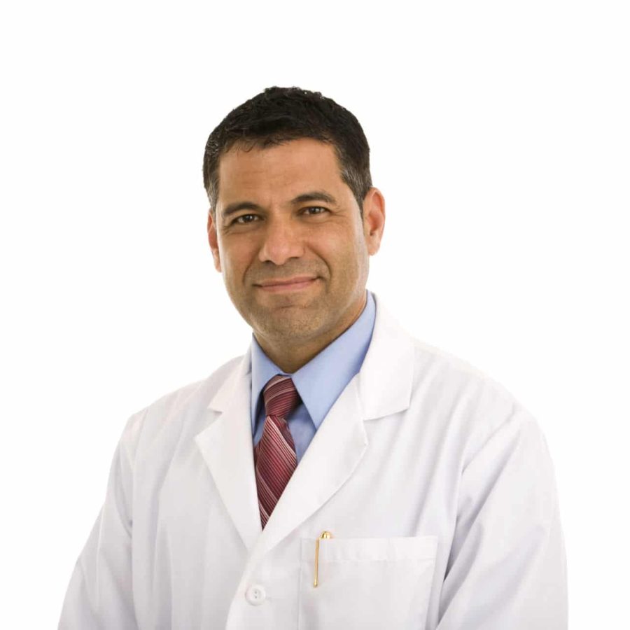 Mid adult male wearing lab coat, copy space available, isolated on white background